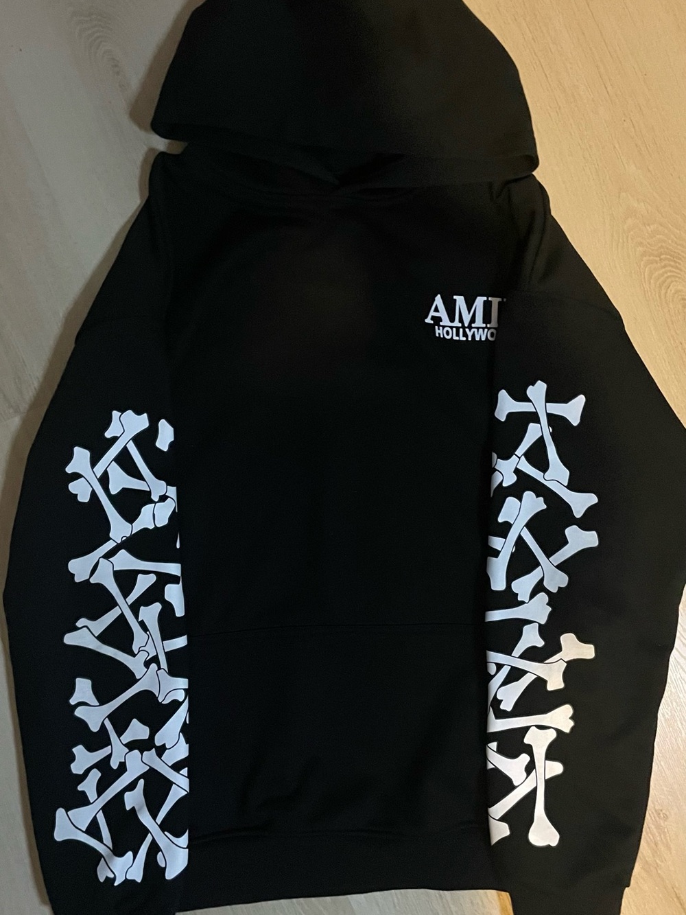 Amiri Black Hoodie with White Sleeve Bones